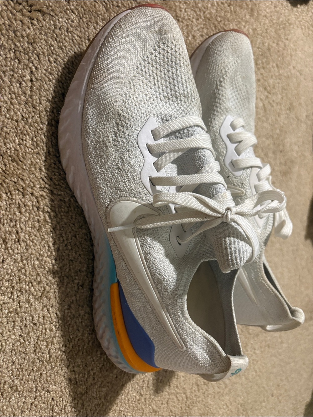 Nike White Knit Sneakers with Blue and Orange Heel Accent